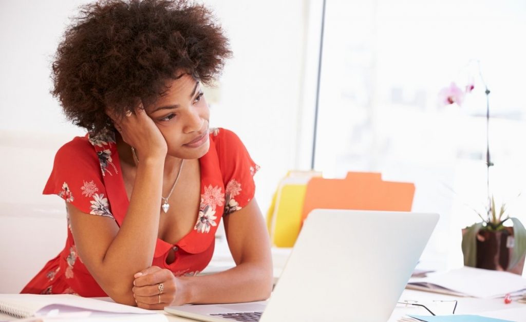 photo of a frustrated woman with a laptop
