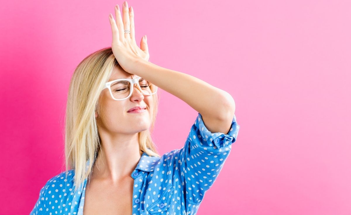photo of a woman slapping her forehead