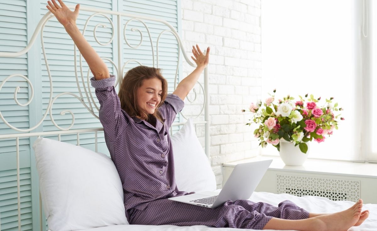 photo of a happy woman with a laptop