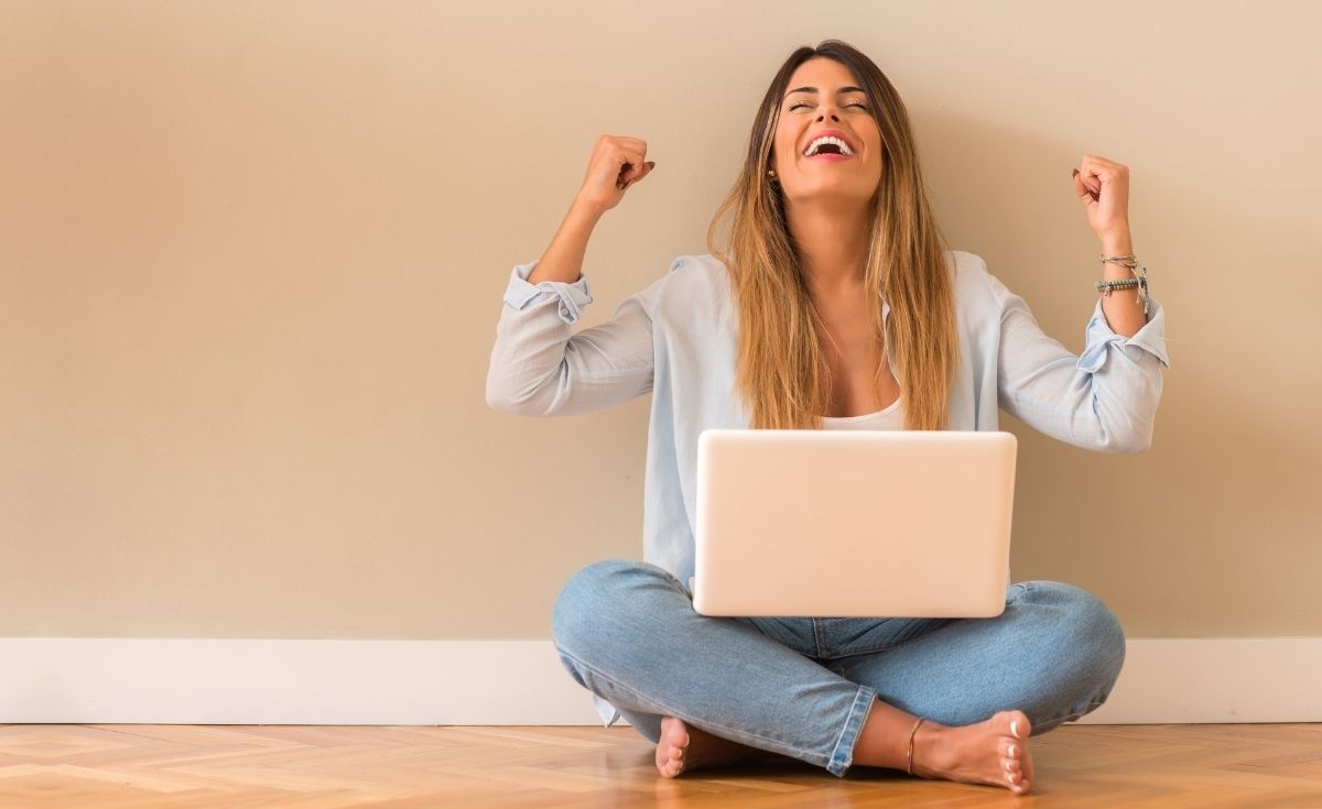 happy woman with a laptop