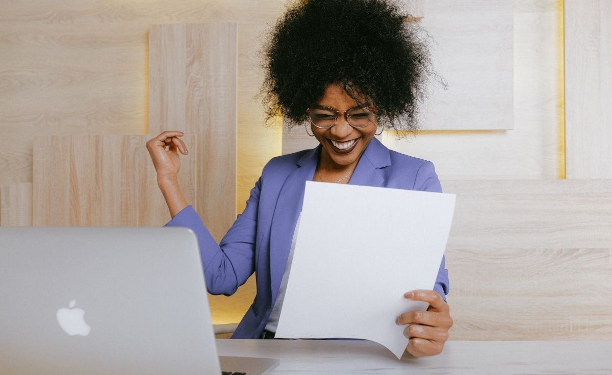 happy woman reading a report
