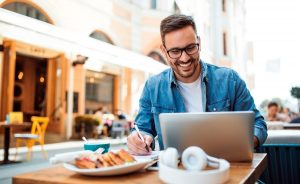 photo of a man with a laptop