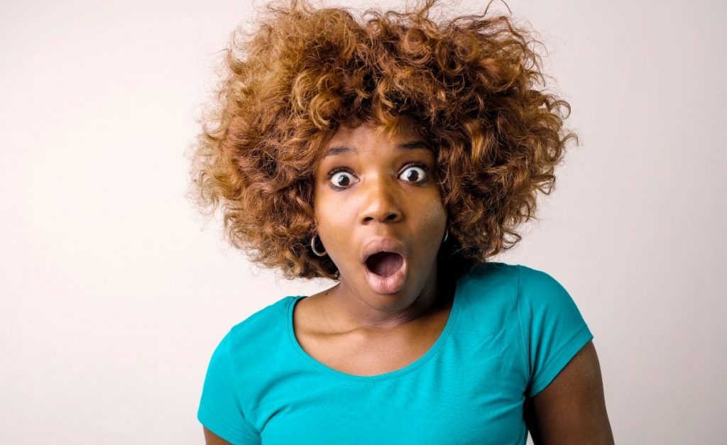 woman looking shocked