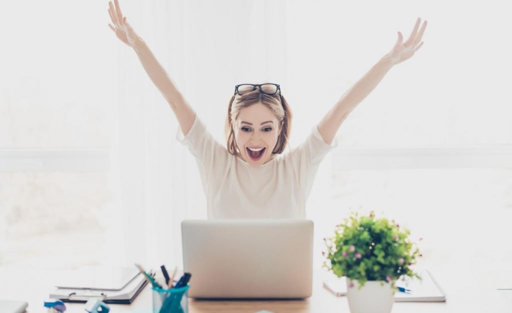 Woman enjoying the results of consistency in business